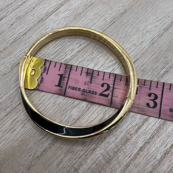 Kate Spade New York Black Enamel and Gold Tone Wave Twist Bangle Bracelet - Picture 5 of 11